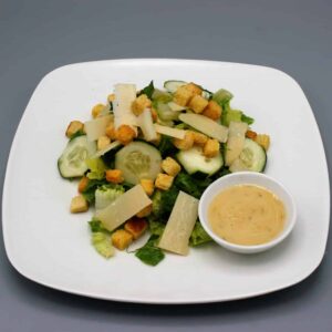Caesar salad with romaine lettuce, croutons, and finely grated Parmesan cheese.