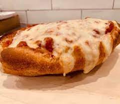 Eggplant alla Parmigiana Hero with marinara sauce and melted mozzarella cheese on a freshly baked roll.