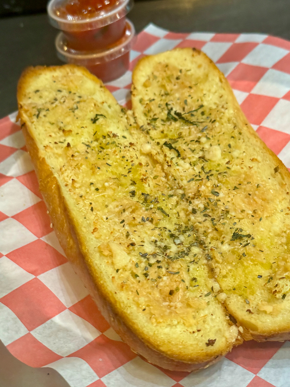 Garlic bread slices with a golden, crispy crust and a soft interior.